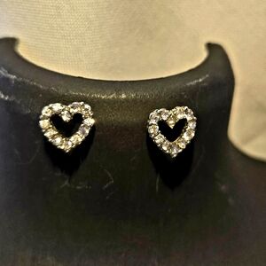 Heart-shaped earring adorned with clear rhinestones